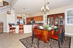 The kitchen has breakfast bar seating and a view from the lanai.