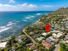 Stunning coastal location just steps from pristine beach and turquoise waters in this charming oceanside neighborhood.