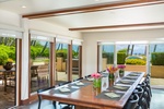 Share meals indoors with tropical views and easy access to the outdoor lanai.