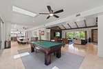 Game room with pool and ping pong table, ideal for friendly competitions and group fun.