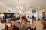 Gather around your spacious dining table while the chef prepares meals in your fully-equipped kitchen, with cozy living areas perfect for relaxing together.