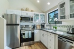 Create island-inspired meals in the fully equipped kitchen featuring granite countertops and stainless steel appliances.