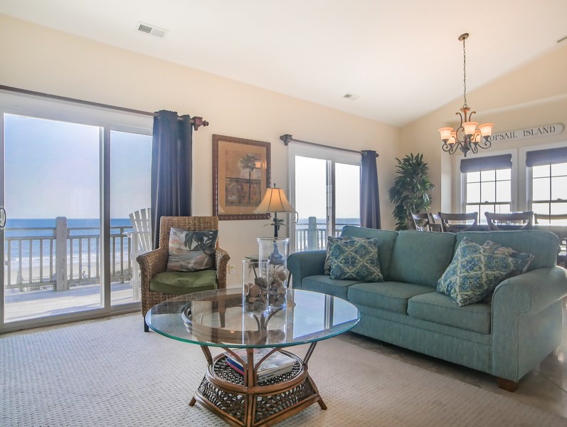The living area with a Smart TV and access to the oceanfront deck