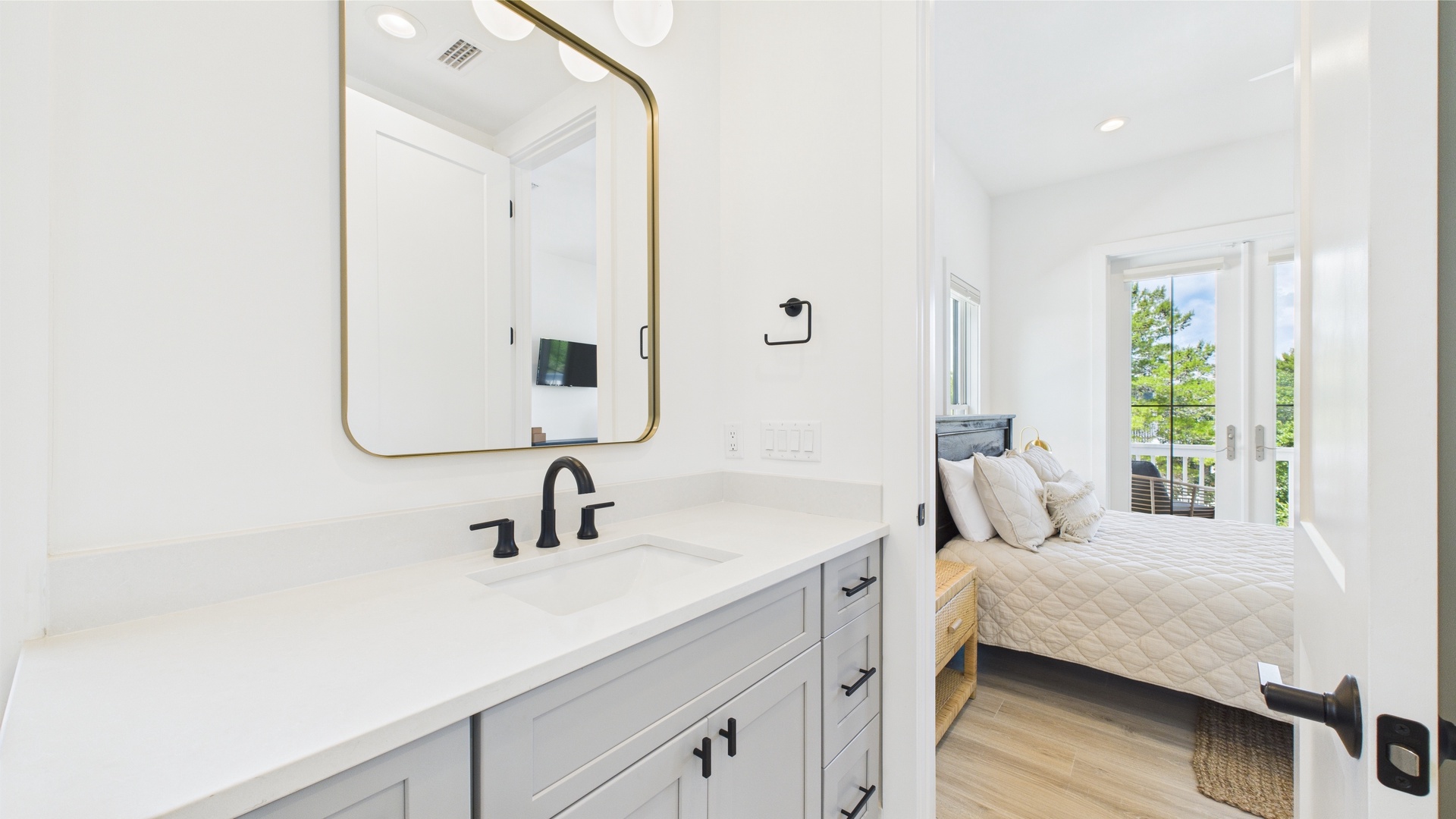 Shared ensuite bathroom with dual vanity and walk in shower