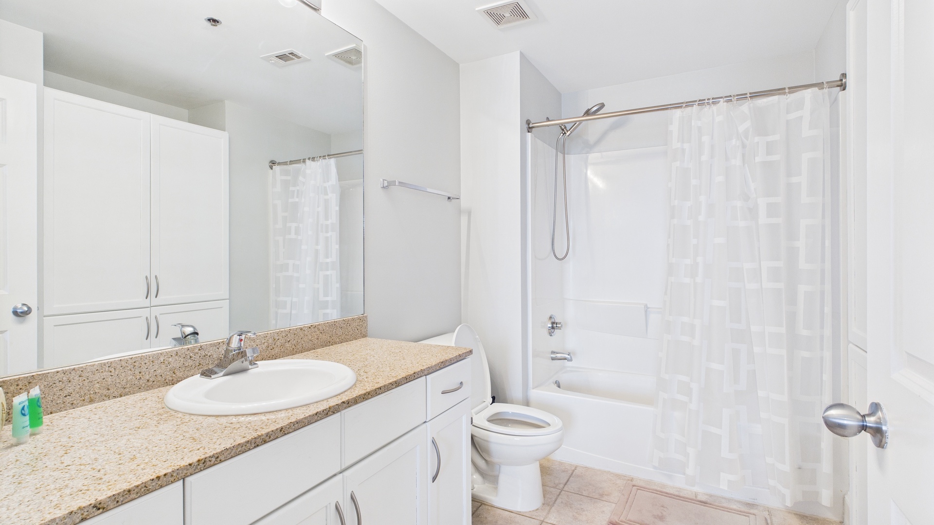 Primary guest bathroom with shower and tub combo