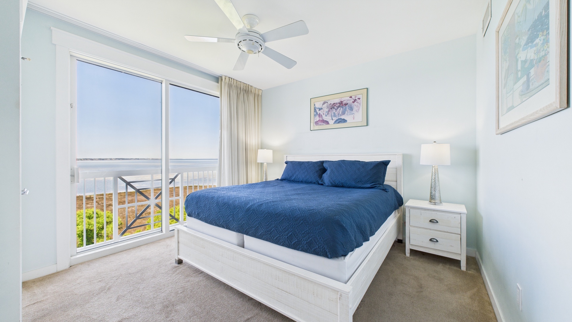 Master bedroom with king bed TV gulf views and ensuite bathroom