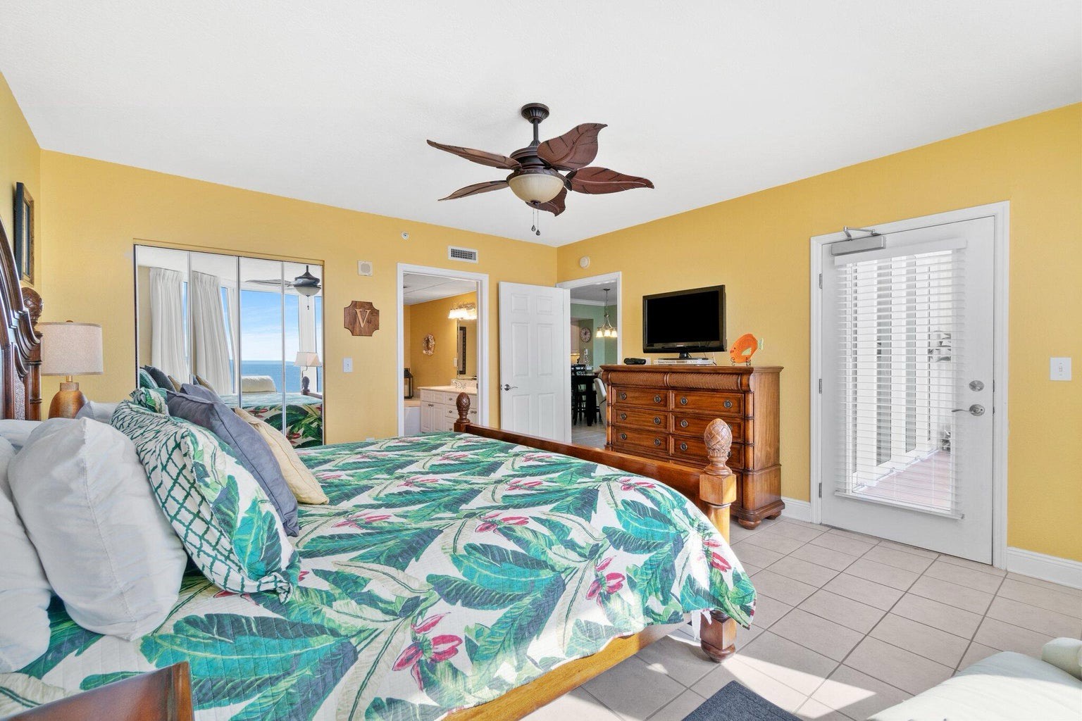 Primary bedroom with king bed and ensuite bathroom