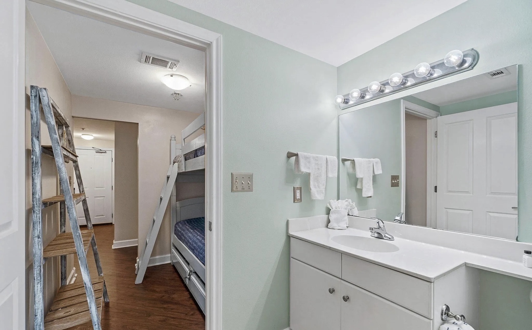 Third bathroom with shower and tub combo.