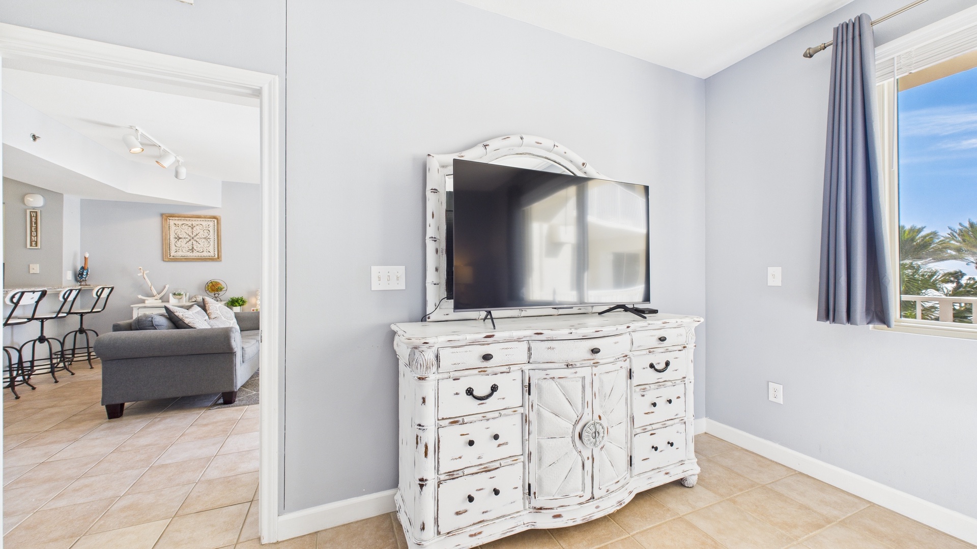 Master bedroom with queen bed TV and ensuite bathroom