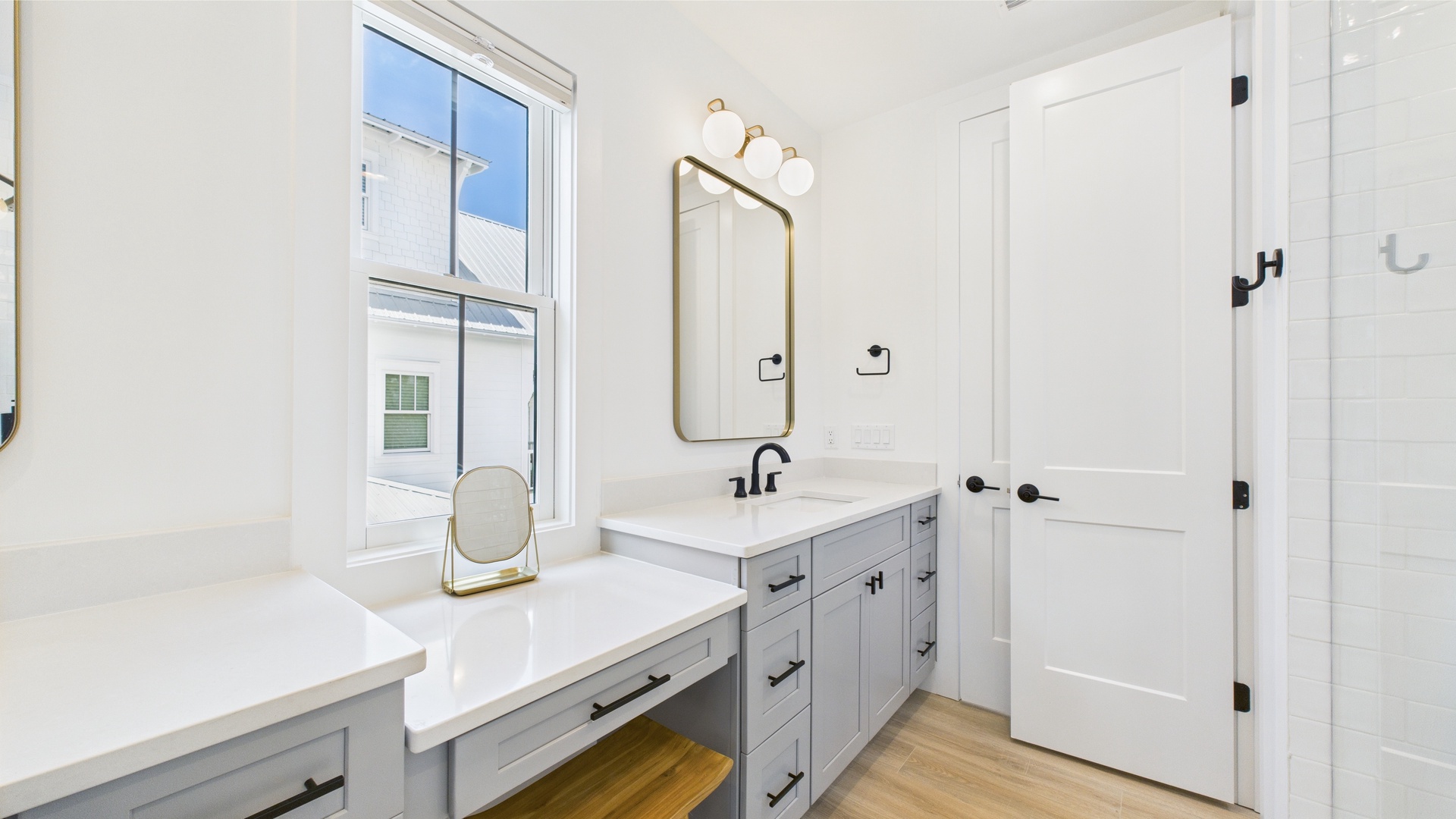 Shared ensuite bathroom with dual vanity and walk in shower