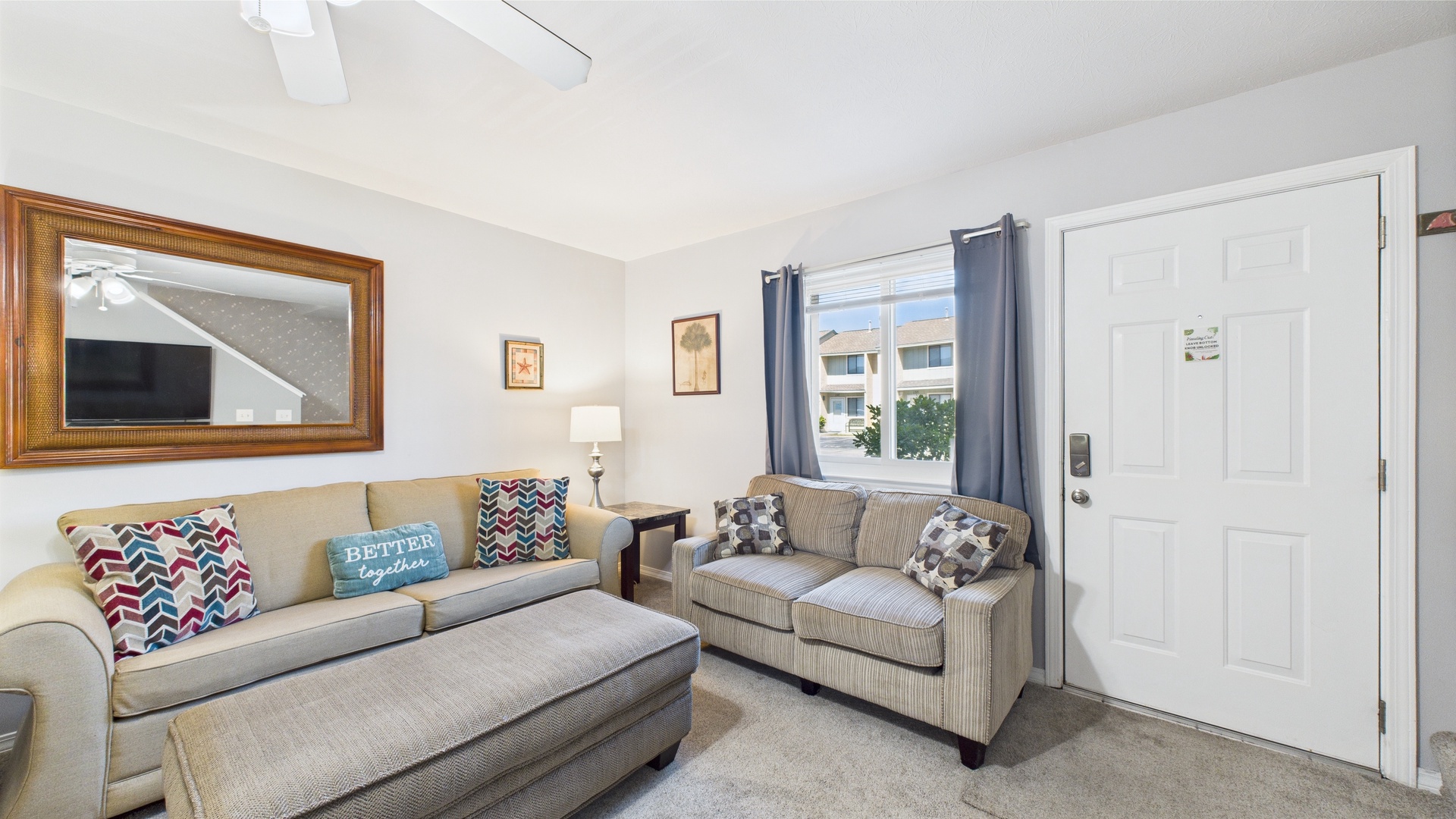 Open concept living area with TV and sleeper sofa