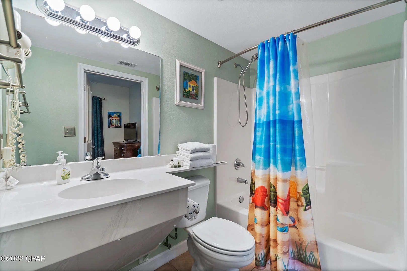 Second bathroom with shower and tub combo.