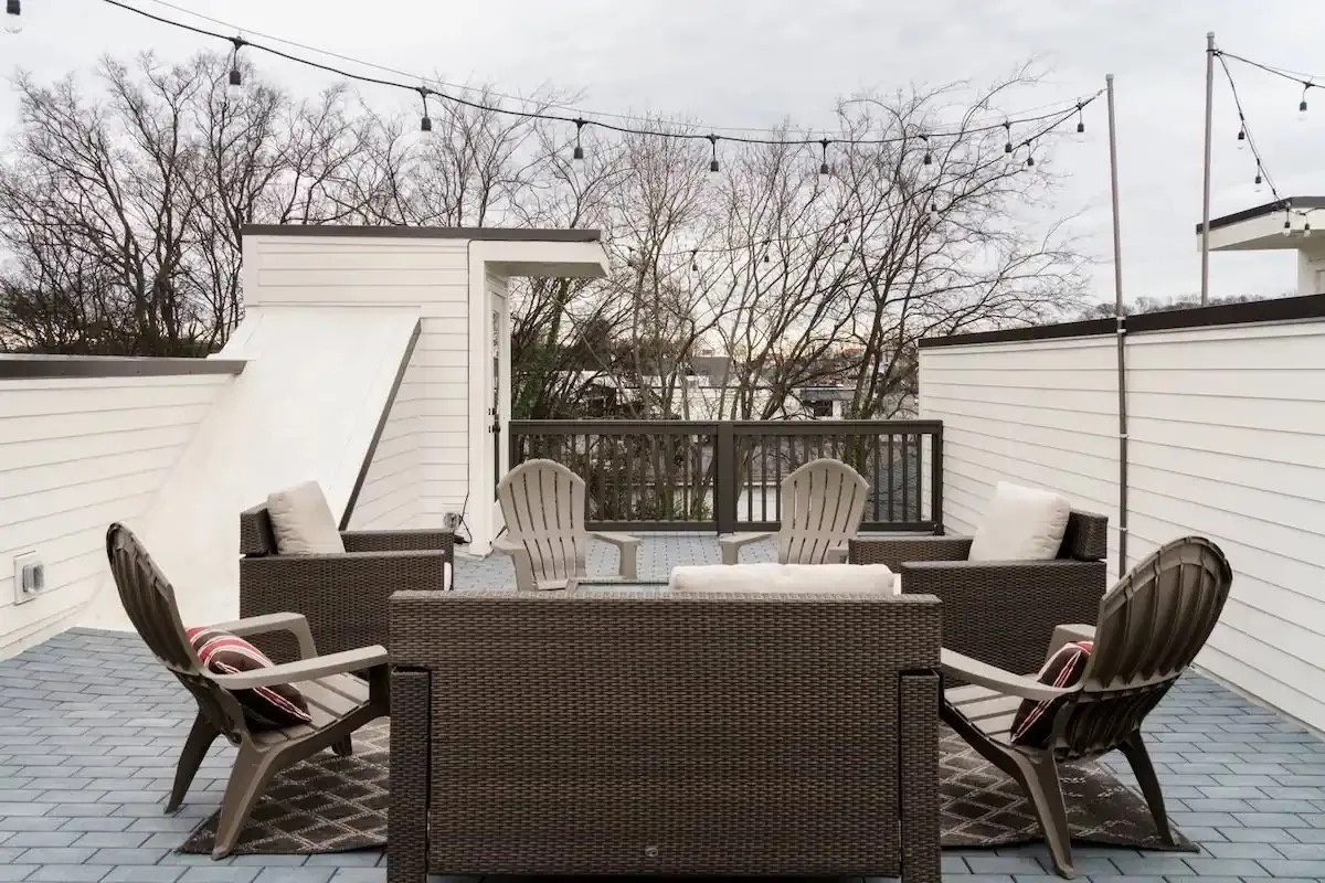 Private rooftop terrace with comfortable furnishings and scenic views