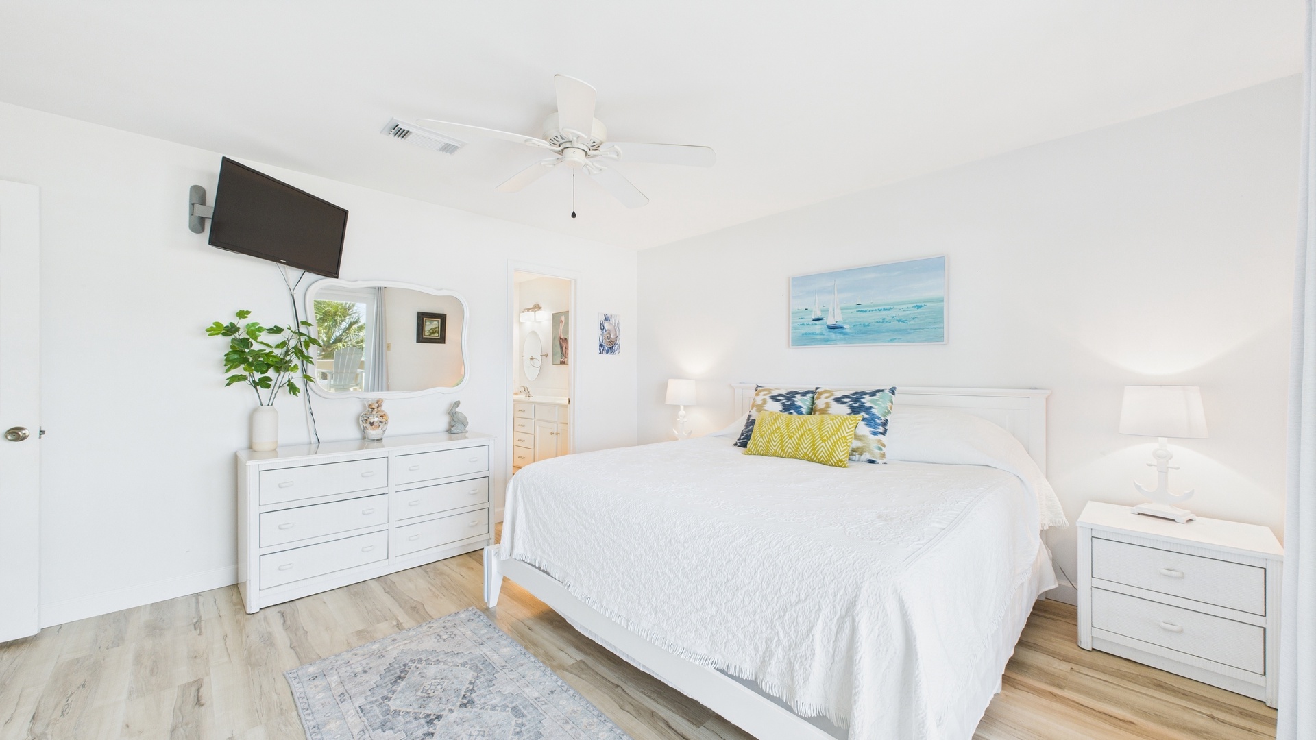 Master bedroom with king bed TV ensuite bathroom and balcony access