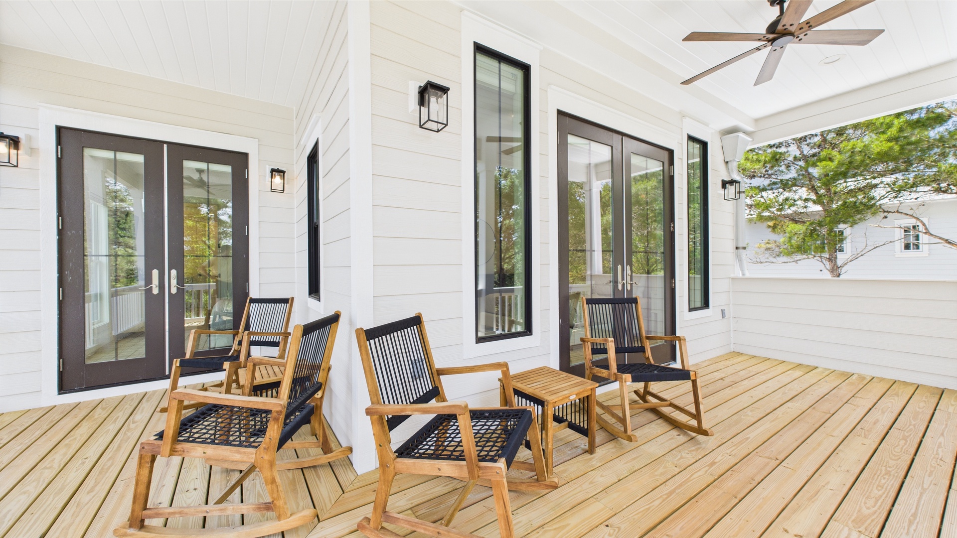 Second floor rear facing wraparound balcony with ample seating