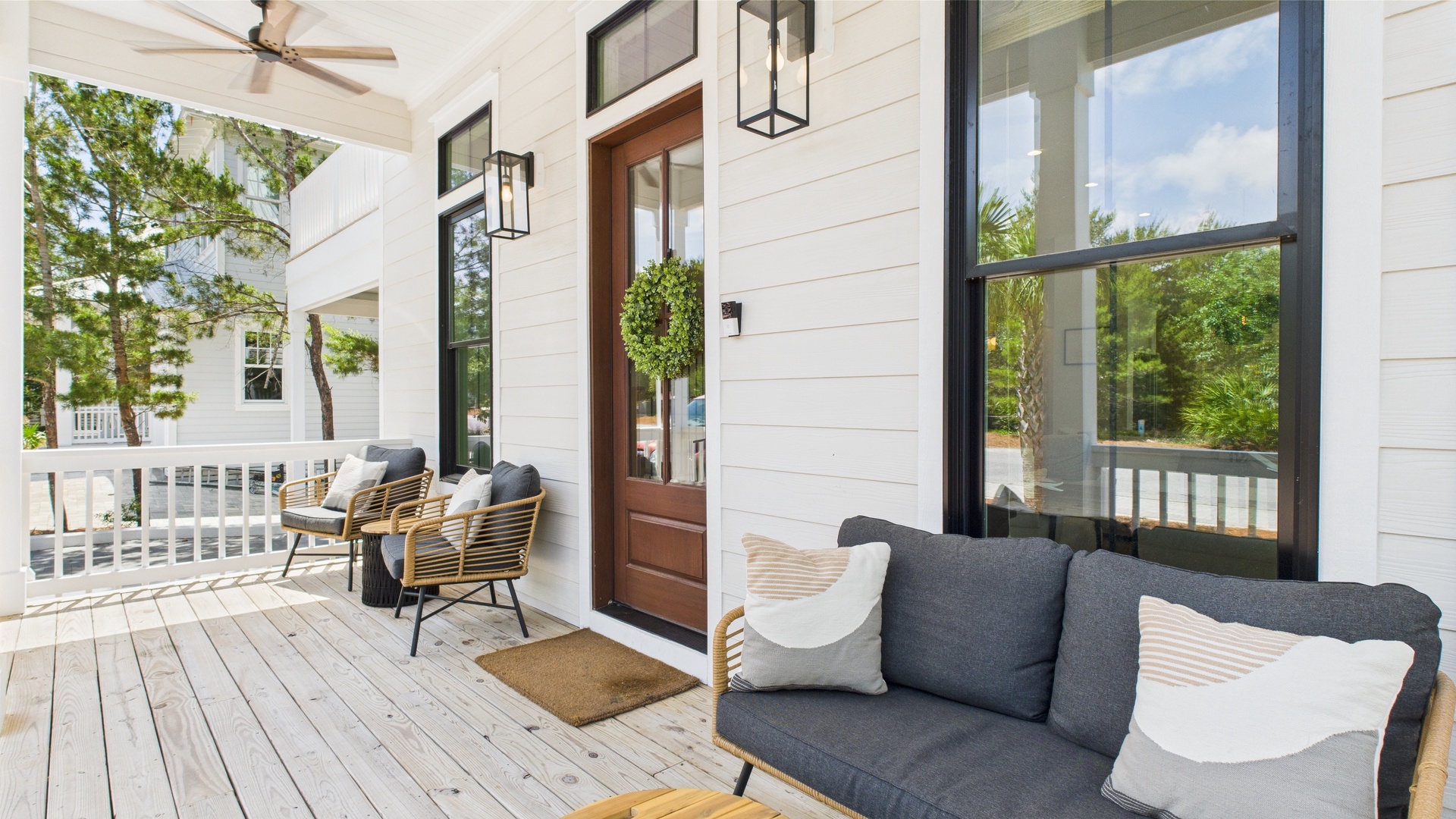 Front porch with comfortable seating and entrance into home