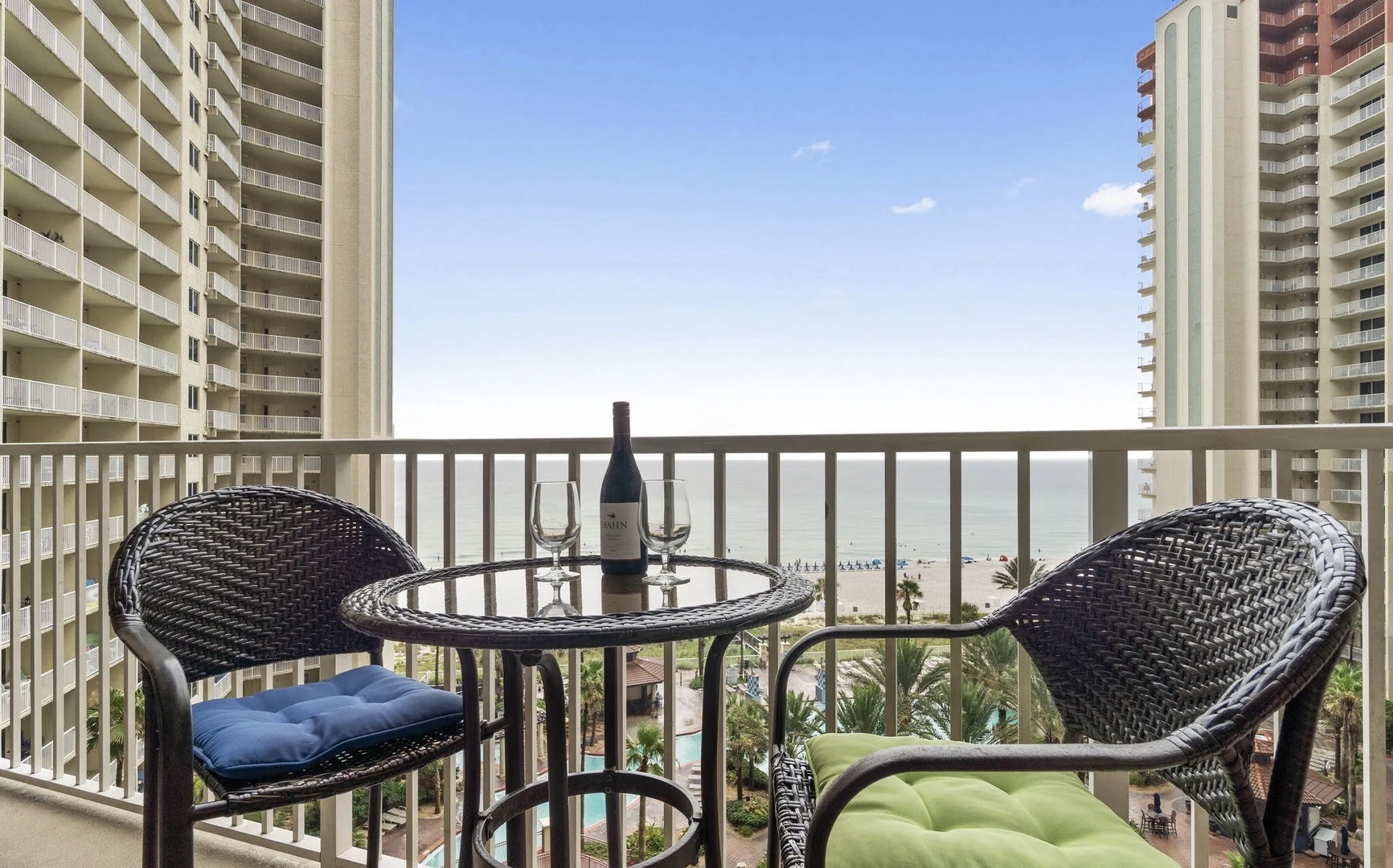 Balcony with comfortable living and dining seating.