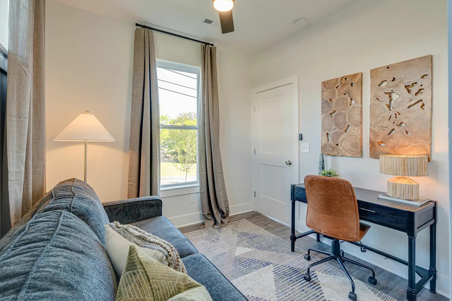5631 - 3rd Bedroom / Office featuring a pull-out couch and workstation.