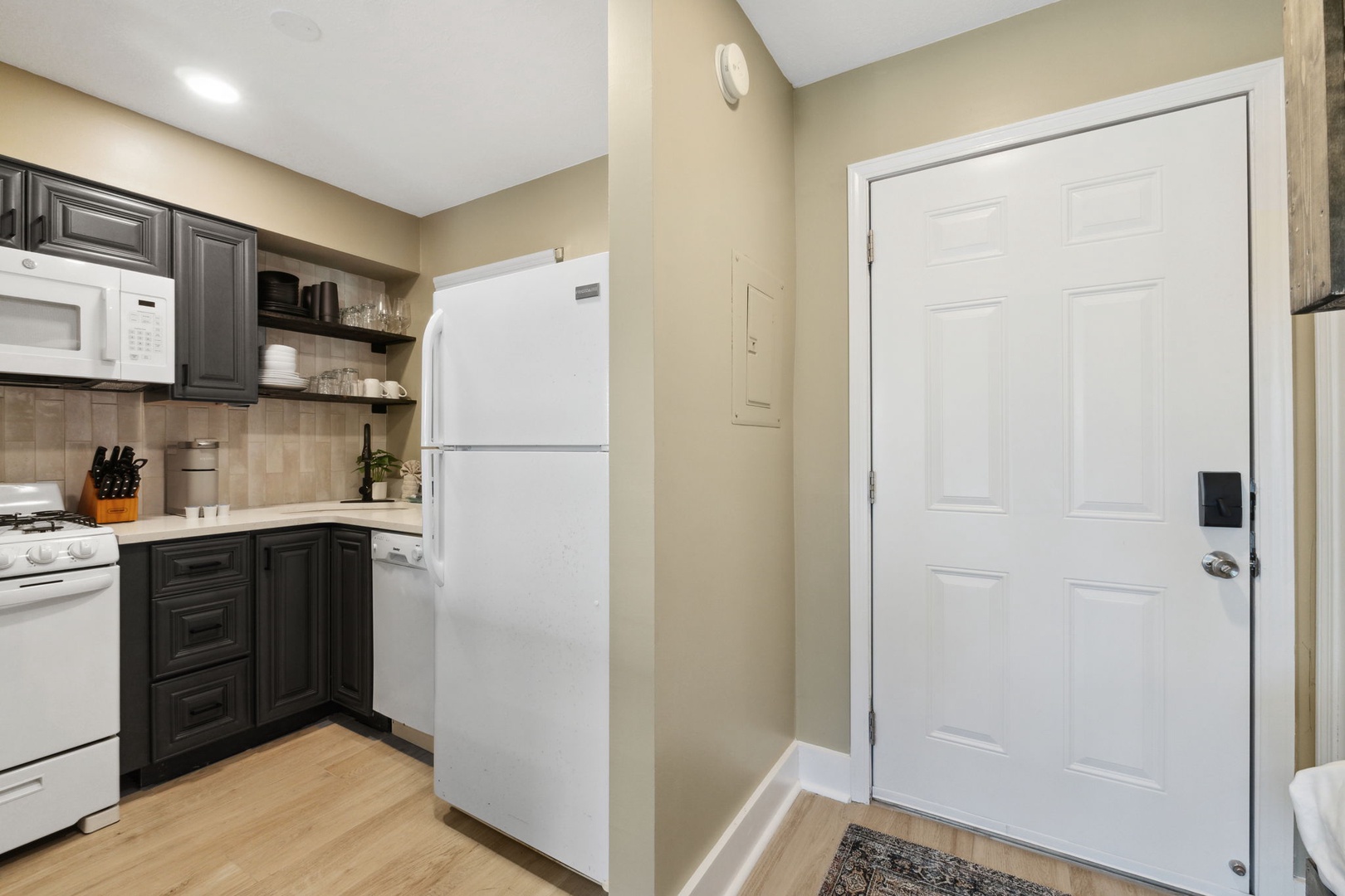 Kitchen area with full size refrigerator