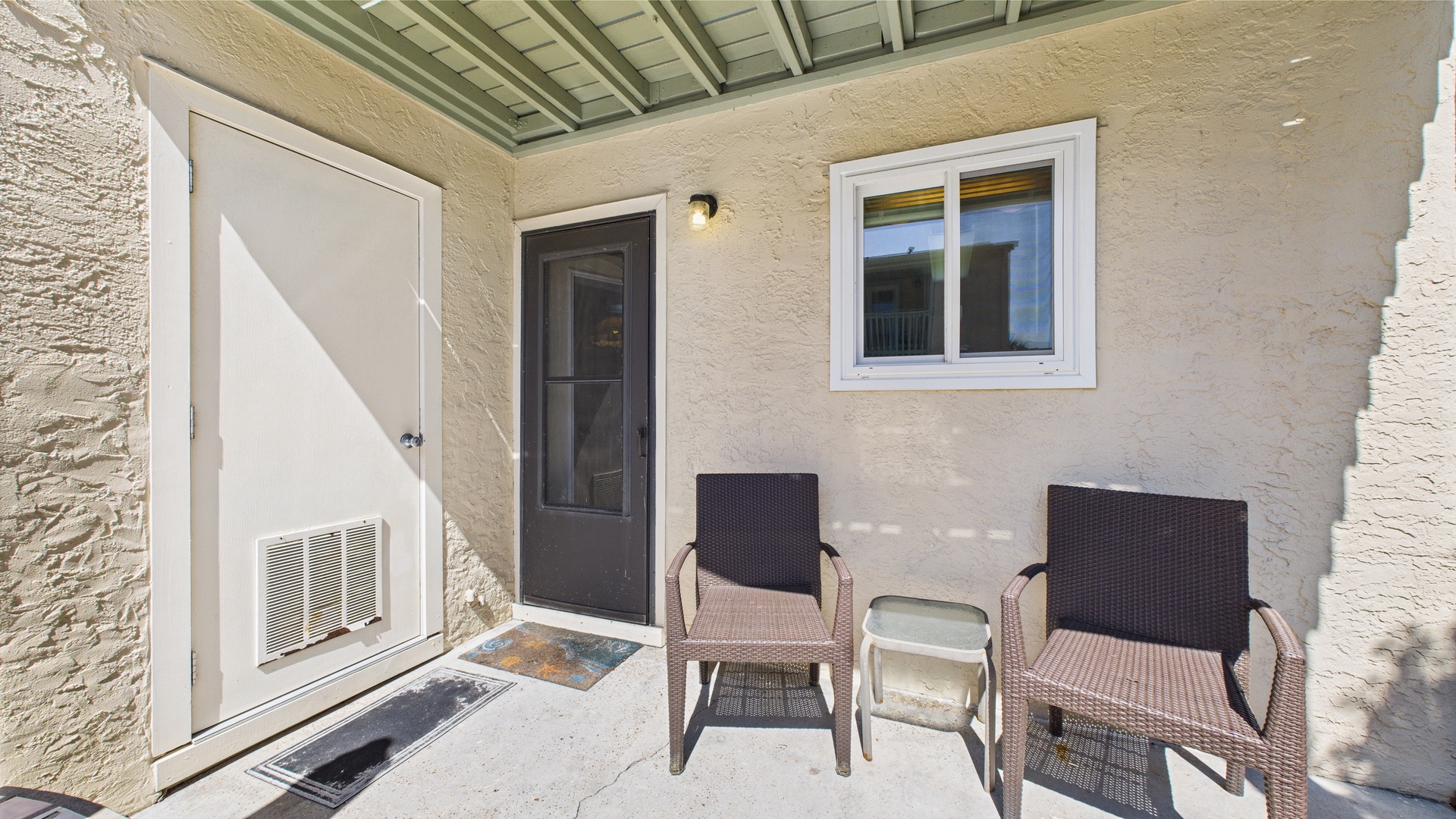 Exterior entry-way with patio and seating