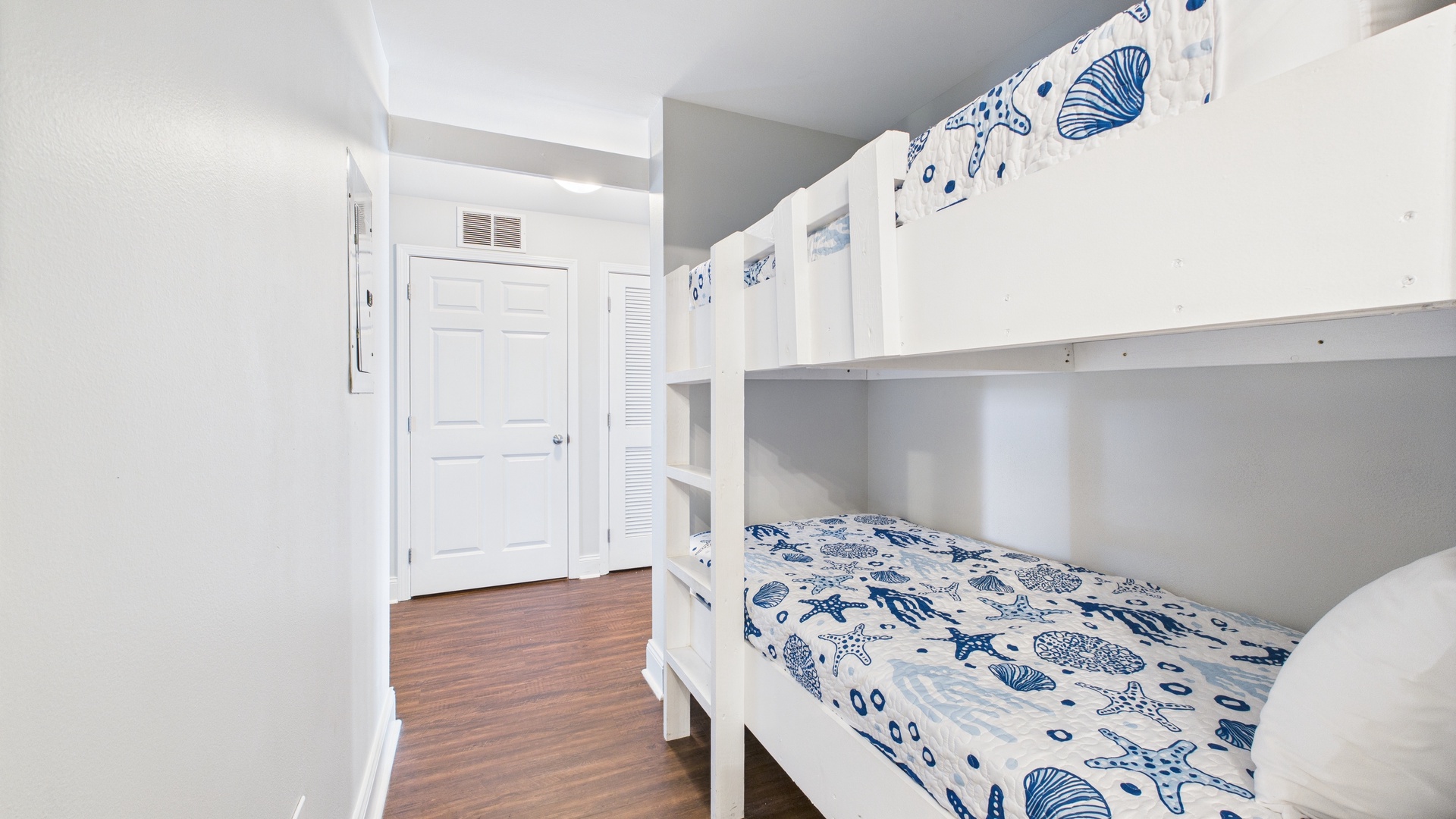 Twin-over-twin bunk bed in hallway nook