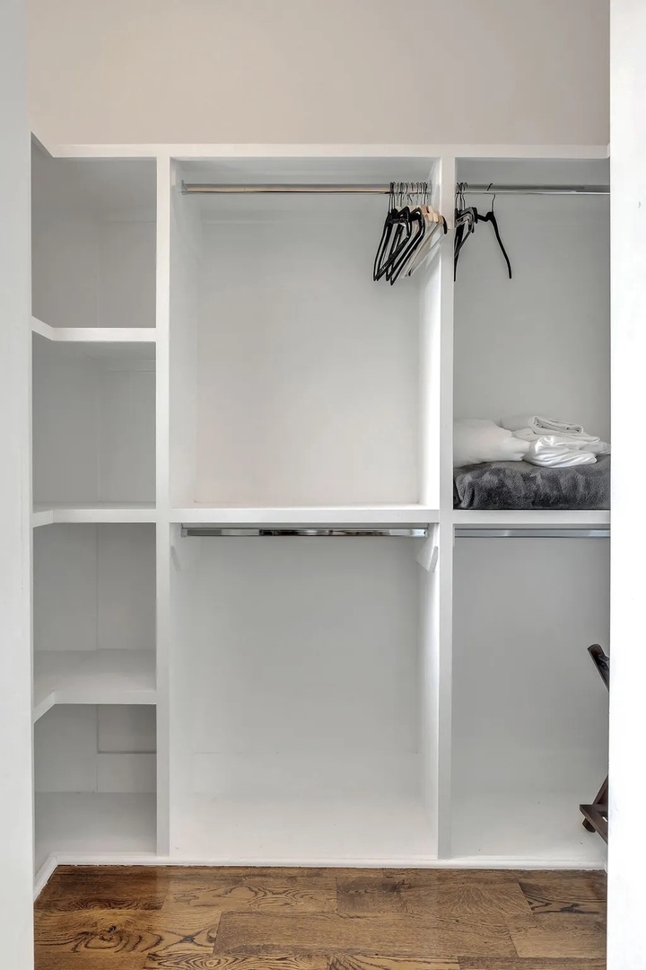 Primary bathroom with dual vanity walk in shower and master closet