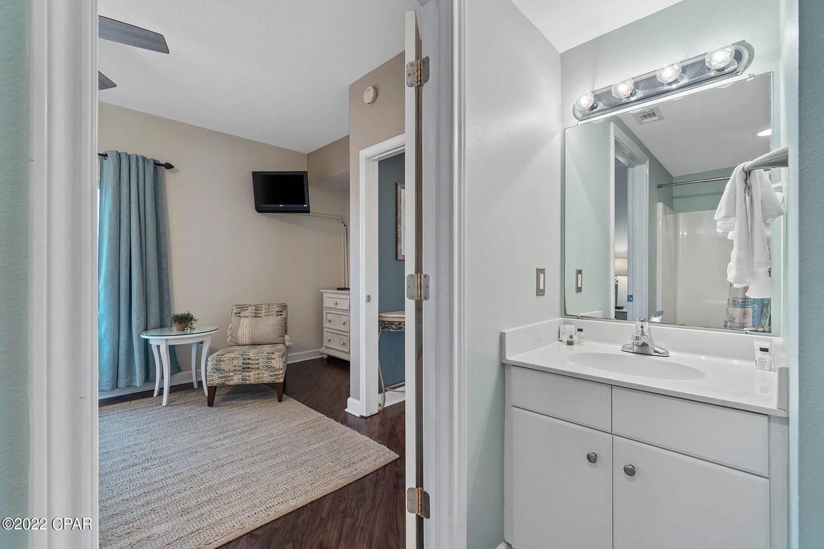 Primary bathroom with shower and tub combo.