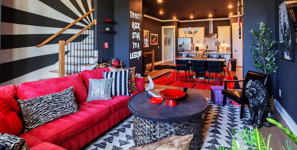 Open concept living area with stylish furnishings and TV