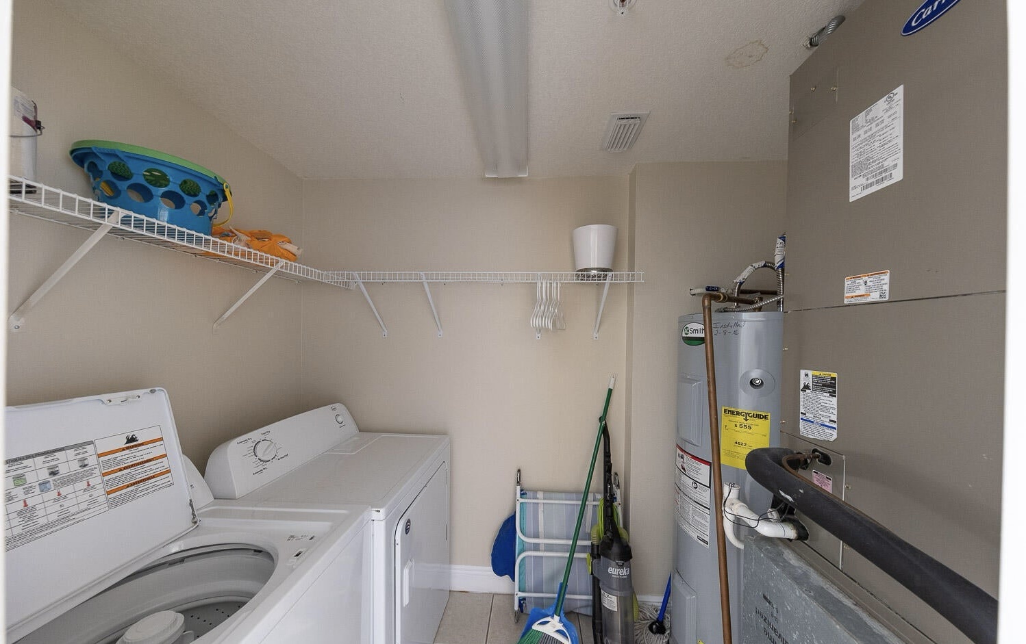 Laundry room with washer and dryer machines