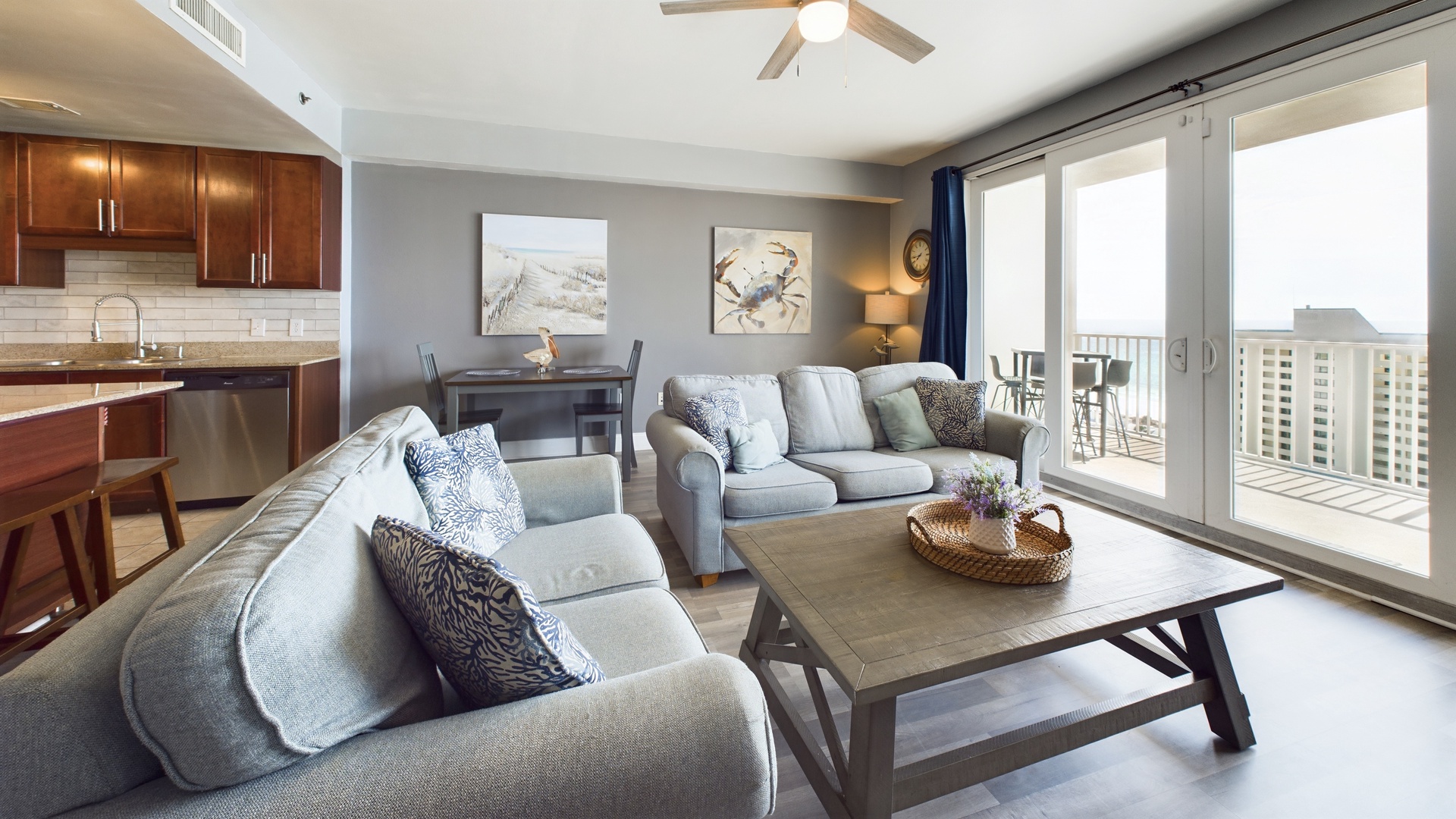 Open concept living area with TV coastal views and sleeper sofa