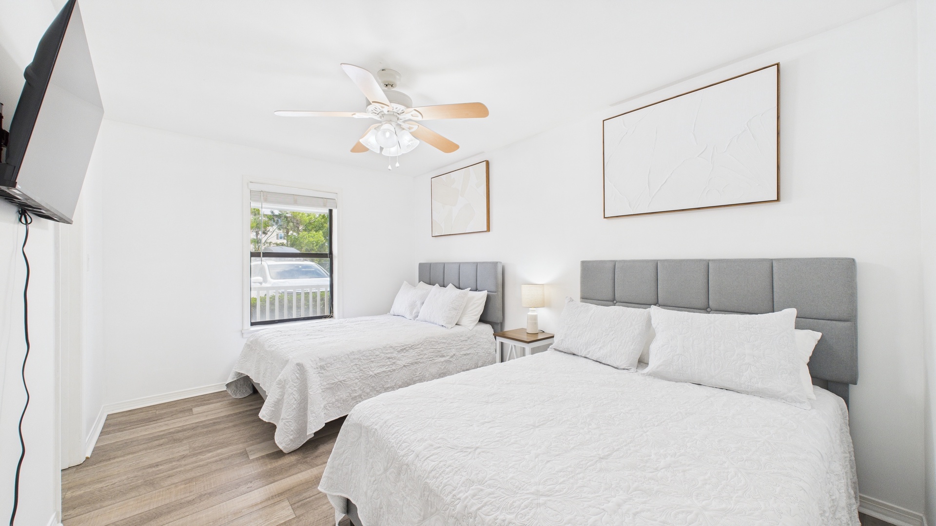 Guest bedroom with two full beds and ensuite