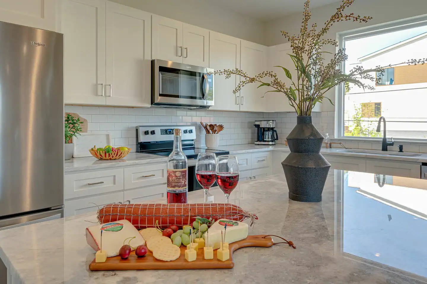 5631 - Fully equipped kitchen stocked with basic cooking essentials and stainless steel appliances.