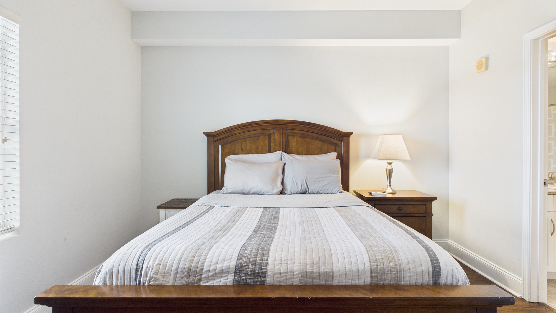 Primary guest bedroom with queen bed and ensuite bathroom (sleeps 2)