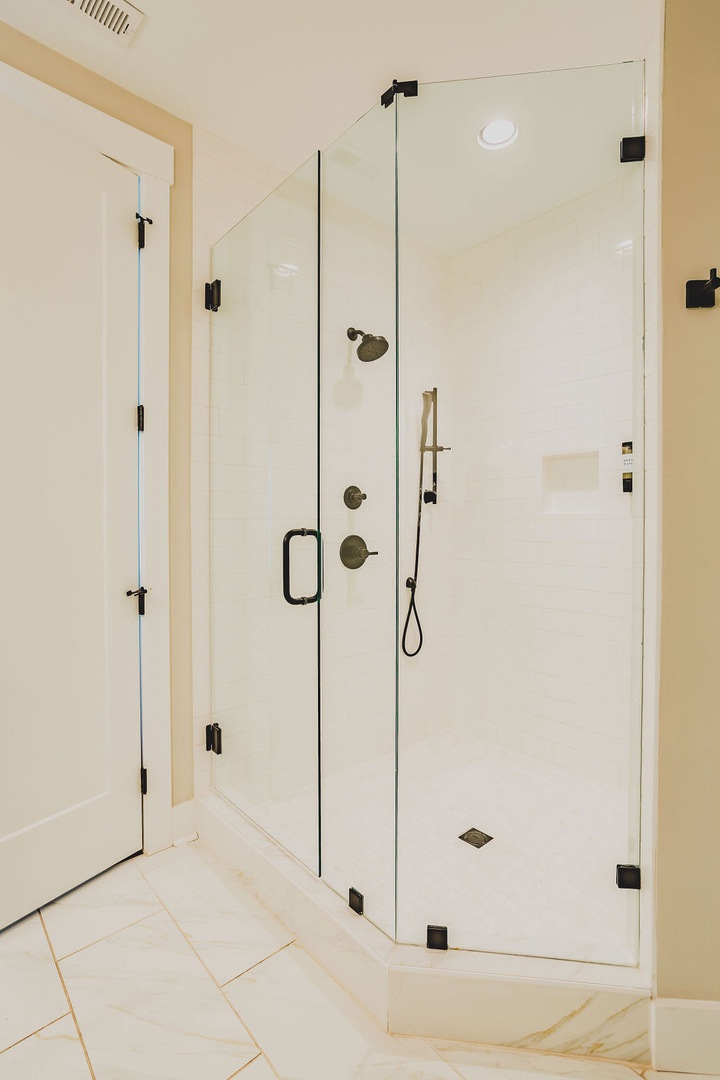 Primary bathroom with dual vanity and walk in shower