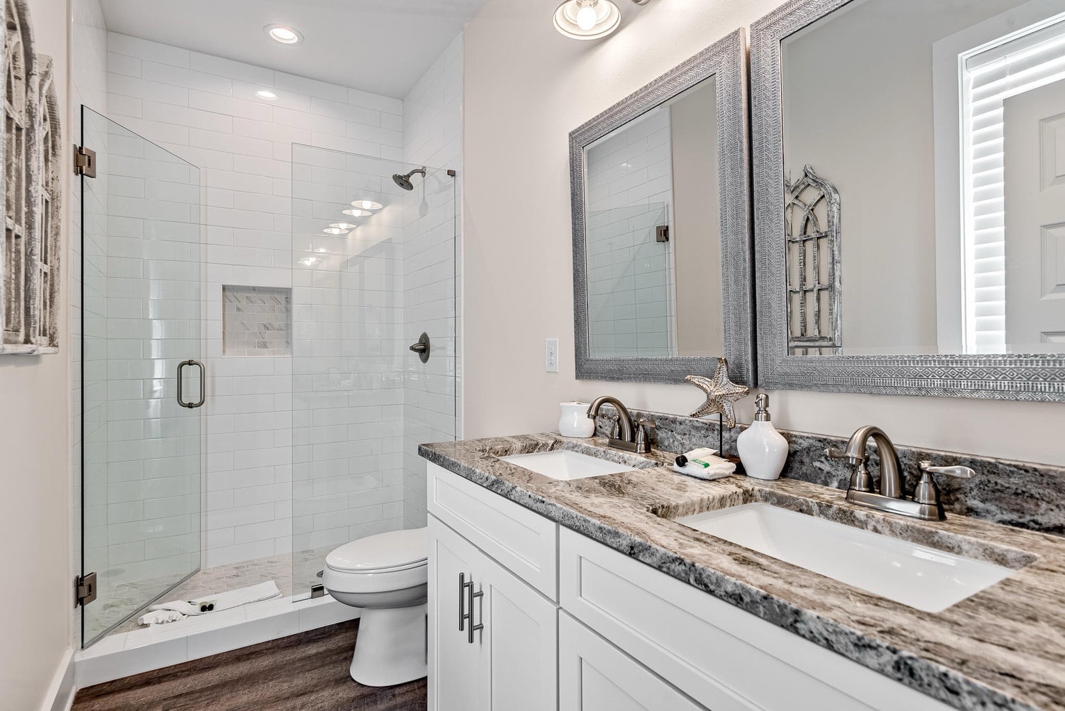 Primary bathroom with dual vanity and walk in shower