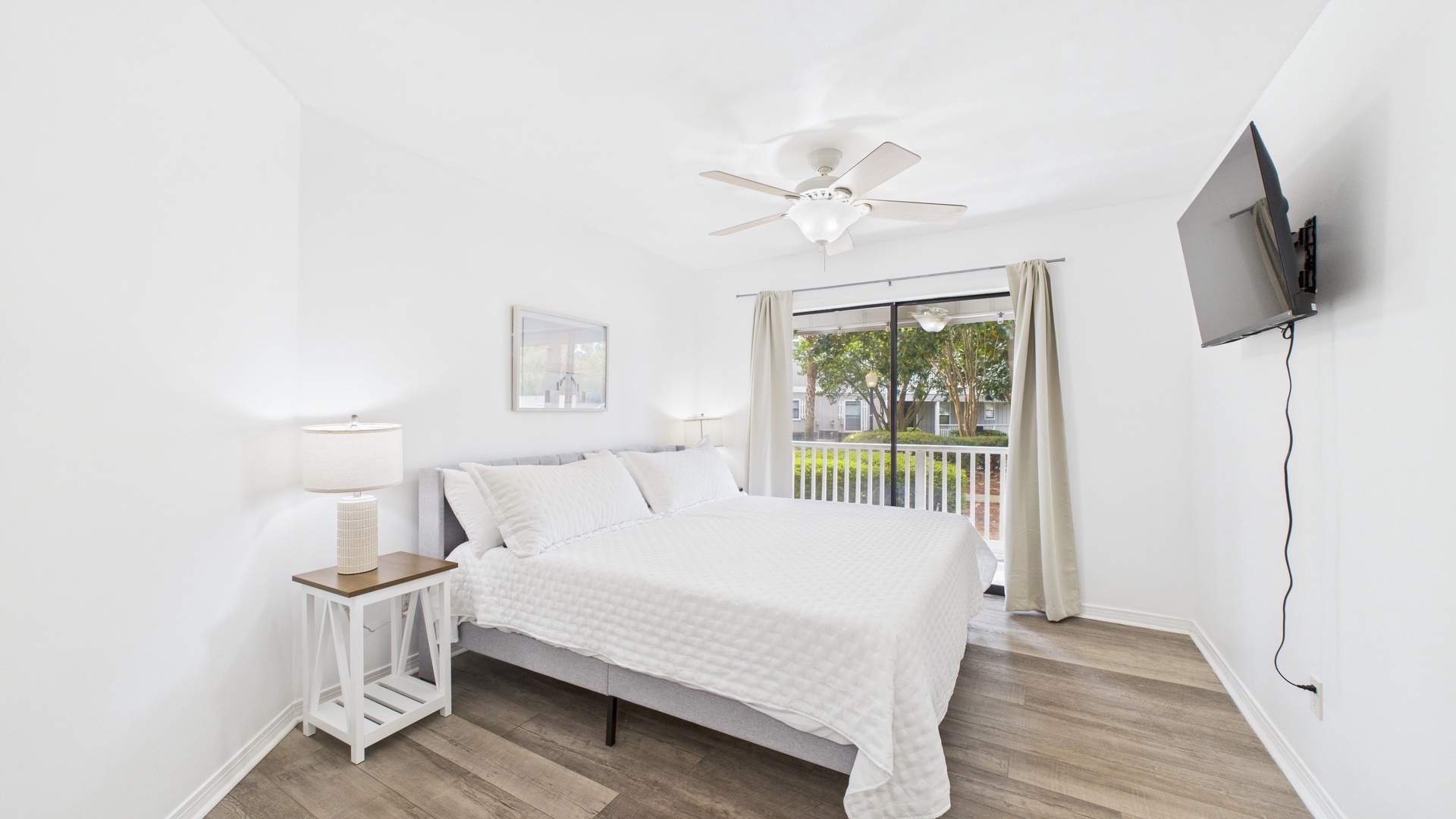 Primary bedroom with king bed and ensuite bathroom