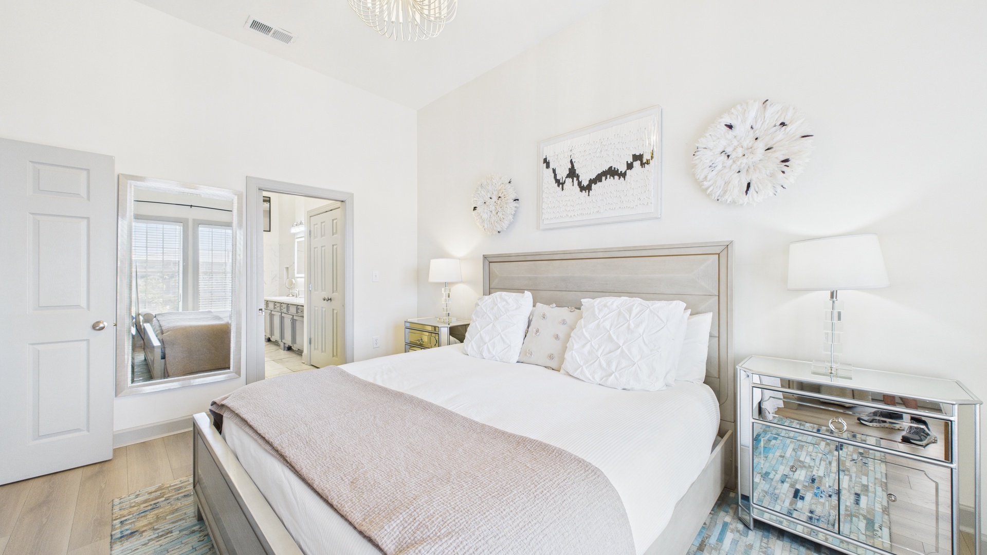 Master bedroom with king size bed and tv screen