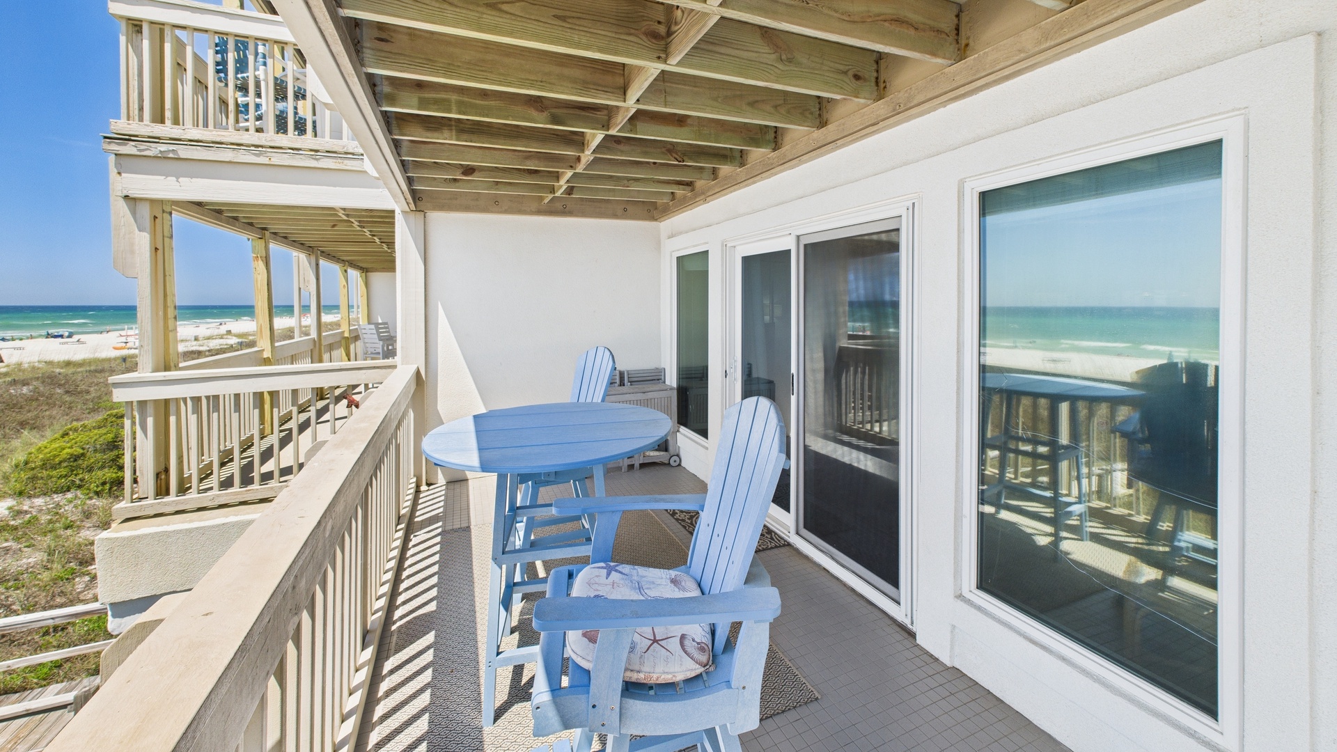 Master bedroom side of balcony with seating and table