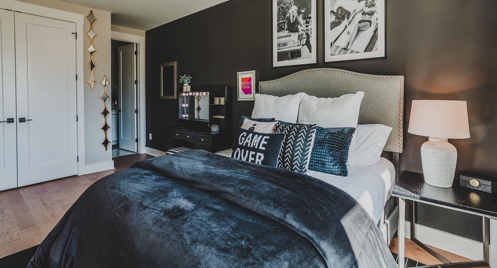 First bedroom with queen bed TV and ensuite bathroom