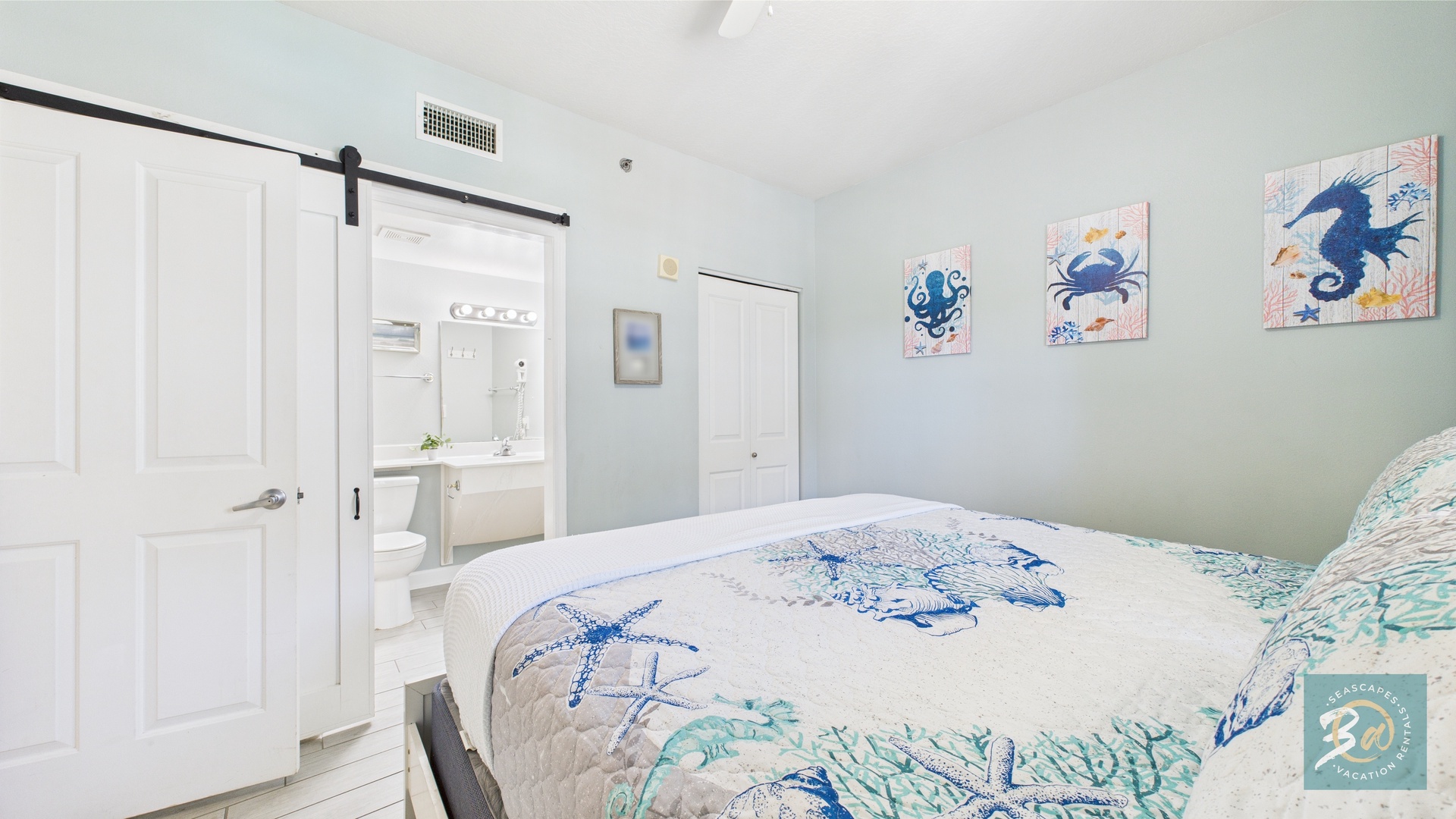 Guest bedroom with queen bed TV and ensuite bathroom