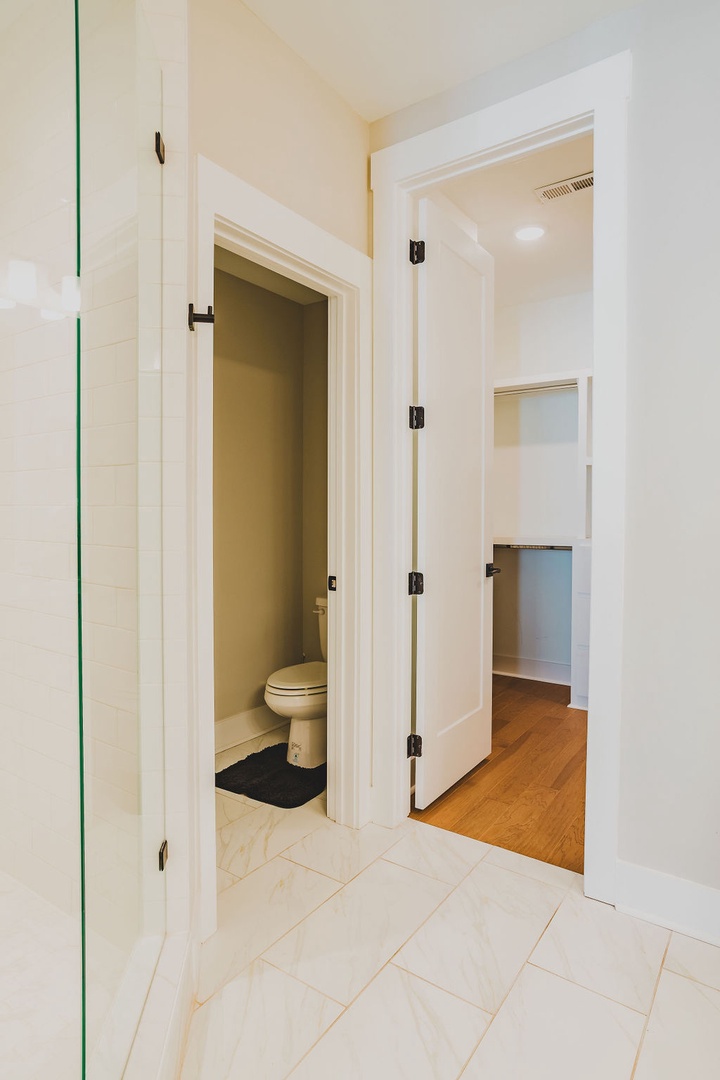Primary bathroom with dual vanity and walk in shower