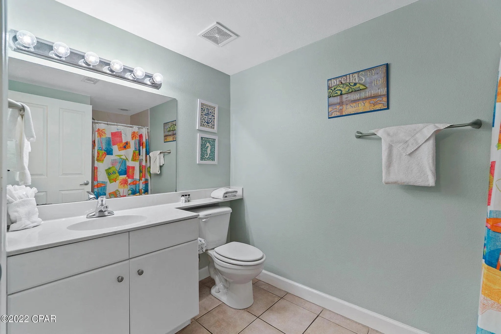 Third bathroom with shower and tub combo.