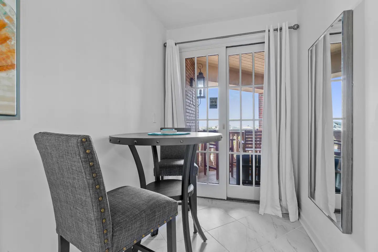 Primary bedroom with king bed desk and ensuite bathroom