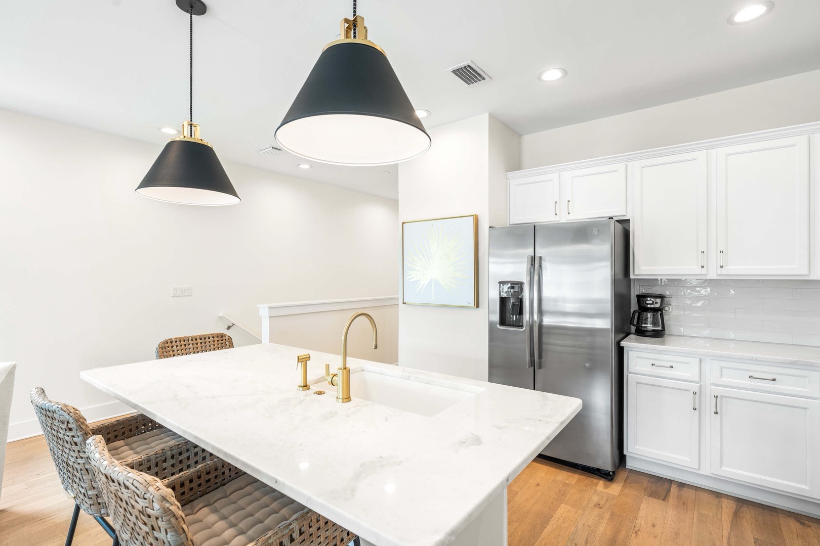 Full kitchen and breakfast bar with seating for 3