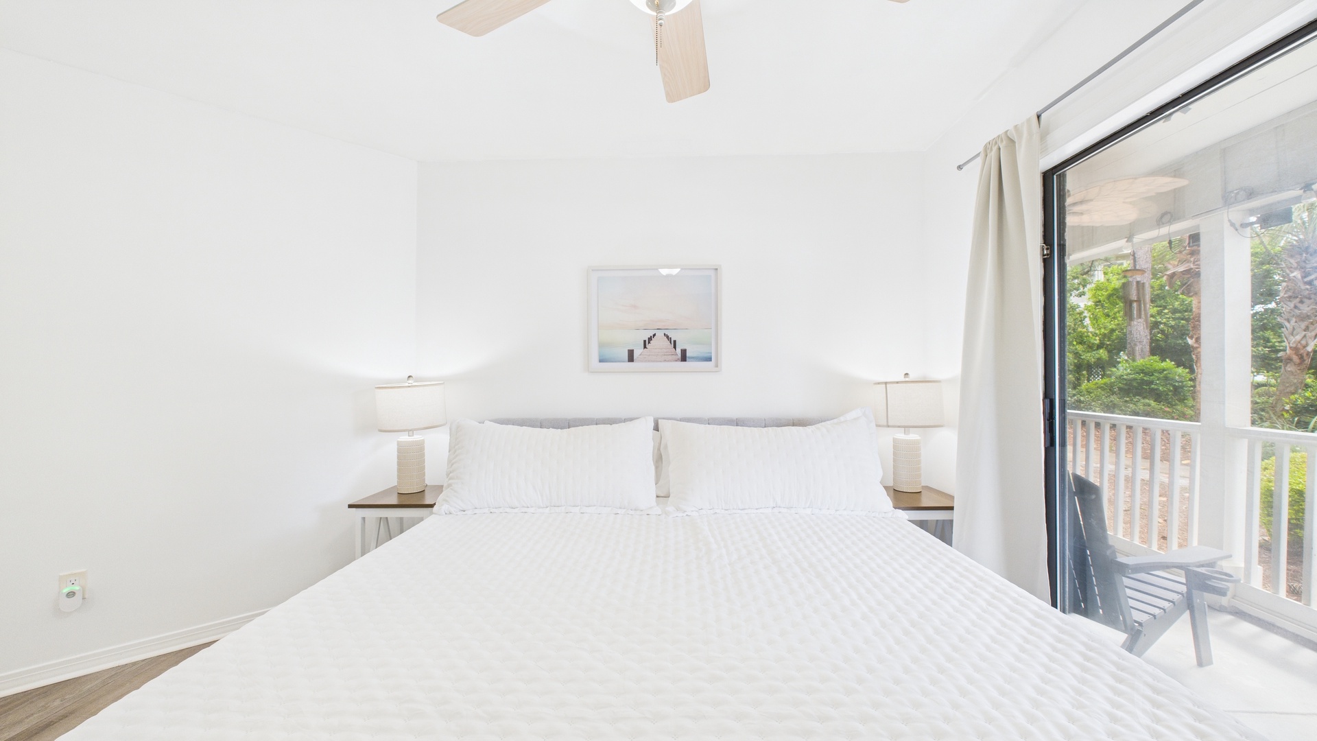 Primary bedroom with king bed and ensuite bathroom