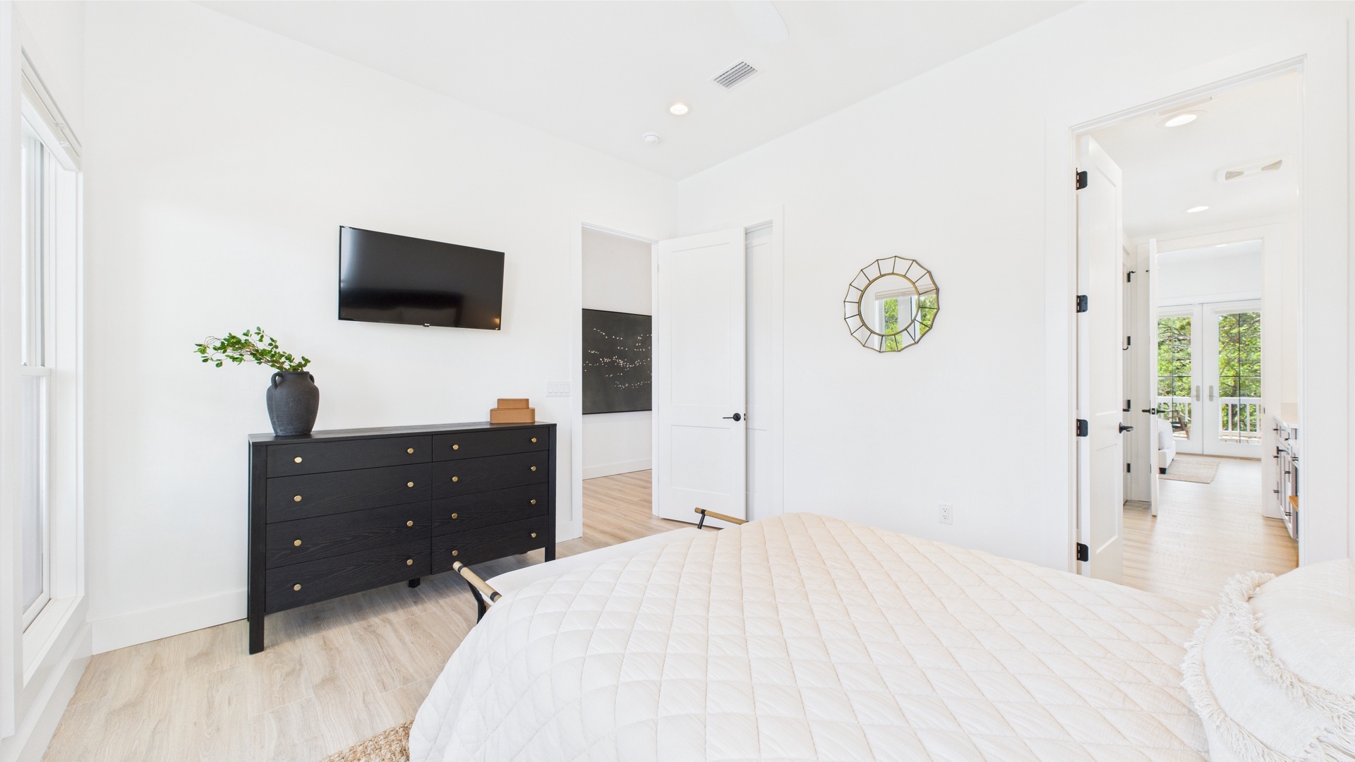 Third bedroom with queen bed TV and shared ensuite bathroom