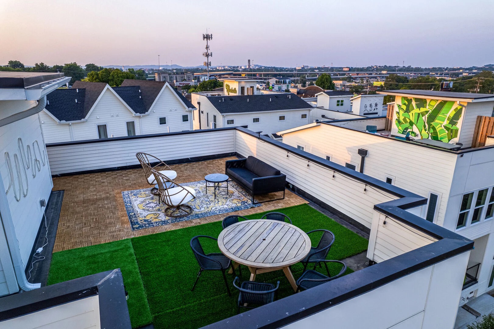 Private rooftop deck with ample seating and dining area
