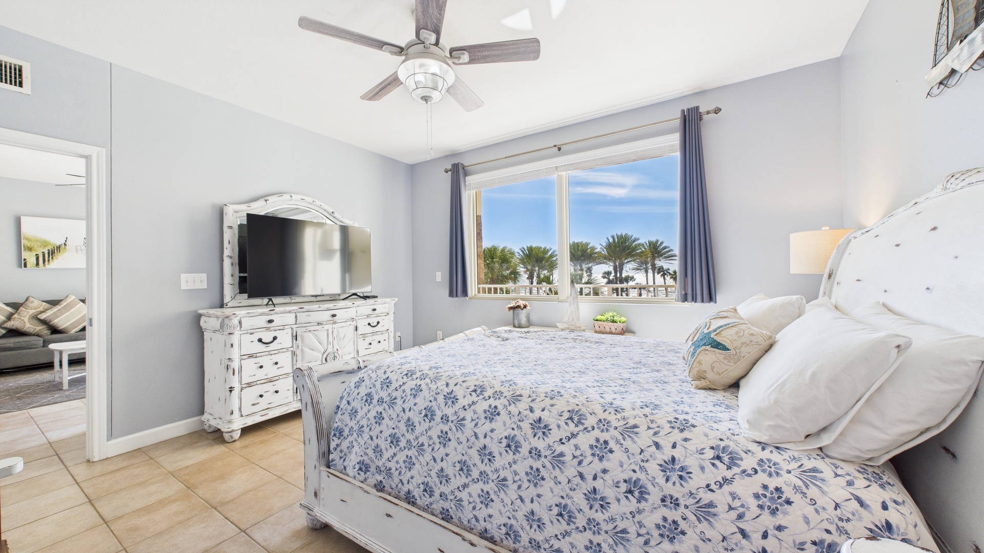 Master bedroom with queen bed TV and ensuite bathroom