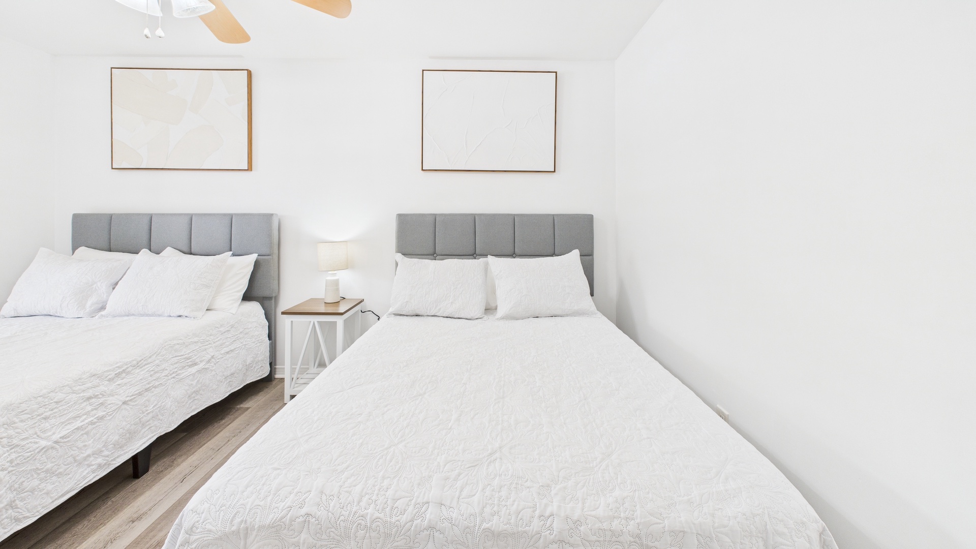 Guest bedroom with two full beds and ensuite