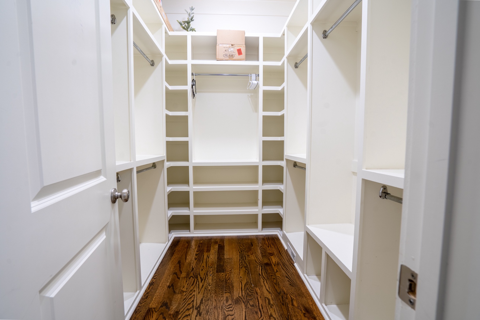 Primary bedroom walk in closet